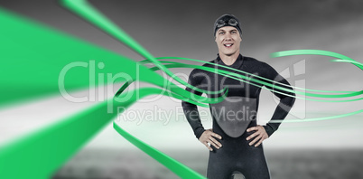 Composite image of portrait of confident swimmer in wetsuit Composite image of portrait of confident swimmer in wetsuit