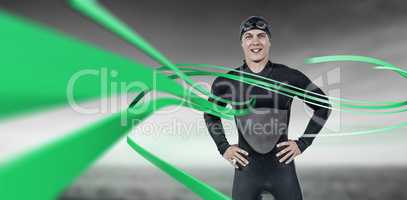 Composite image of portrait of confident swimmer in wetsuit