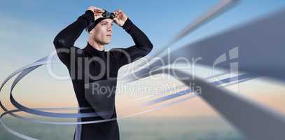 Composite image of swimmer in wetsuit wearing swimming goggles