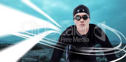 Composite image of confident swimmer in wetsuit