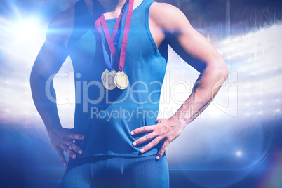 Composite image of portrait of sportsman chest with medals