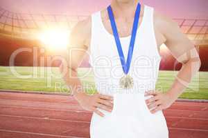 Composite image of close-up of athlete with olympic medal