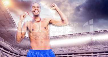 Composite image of sporty man celebrating his victory