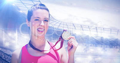 Composite image of portrait of sportswoman is smiling and showin Composite image of portrait of sportswoman is smiling and showin