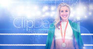 Composite image of athlete posing with gold medal after victory