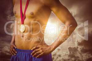 Composite image of close up of sportsman chest with a medal