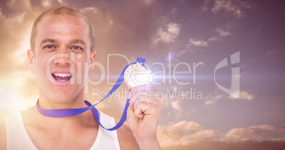 Composite image of close-up of athlete with olympic medal