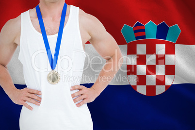 Composite image of close-up of athlete with olympic medal