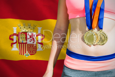 Composite image of close up of sportswoman chest with medals