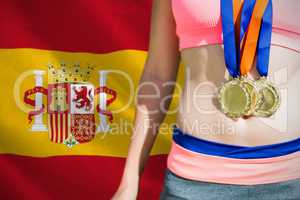 Composite image of close up of sportswoman chest with medals