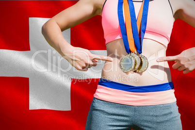 Composite image of close up of sportswoman chest with medals Composite image of close up of sportswoman chest with medals