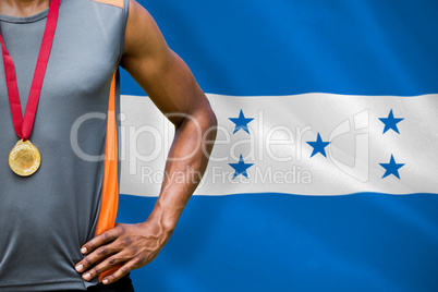 Composite image of portrait of sportsman chest with medals