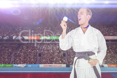 Composite image of fighter holding gold medal and screaming