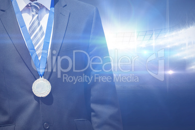 Composite image of close up of businessman chest with medal