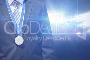 Composite image of close up of businessman chest with medal