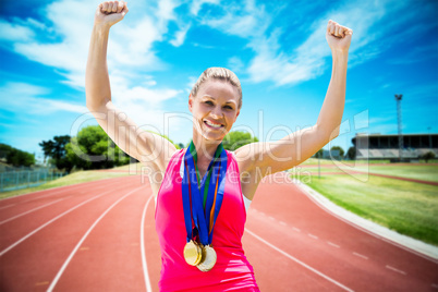 Composite image of portrait of happy sportswoman is winning