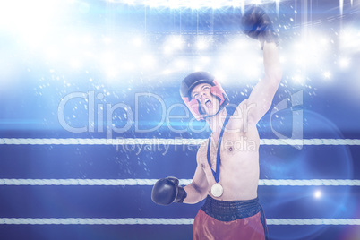 Composite image of boxer wearing gold medal performing boxing st