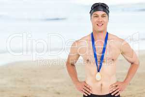 Composite image of victories swimmer posing with gold medal arou