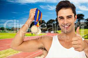 Composite image of athlete posing with gold medals