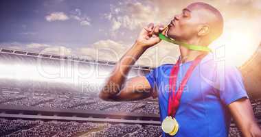 Composite image of profile view of winner kissing medals