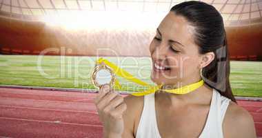 Composite image of female athlete posing with gold medals after