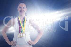 Composite image of athlete posing with gold medals around his ne