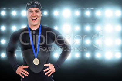 Composite image of victorious swimmer posing with gold medal aro