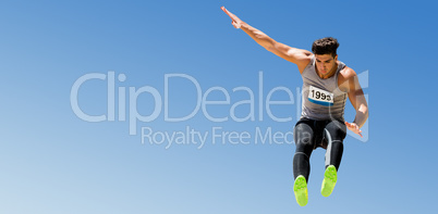 Composite image of sportsman jumping on a white background