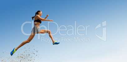 Composite image of profile view of sportswoman jumping