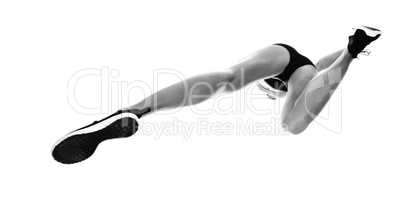 Low angle female athlete jumping