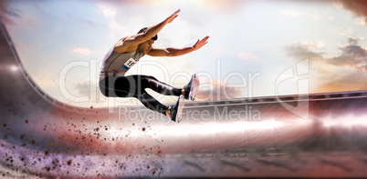 Composite image of portrait of sportsman jumping