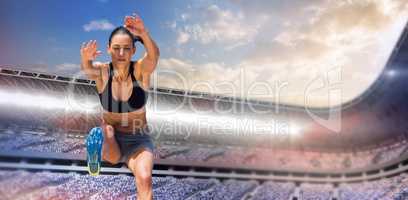Composite image of sportswoman jumping on a white background