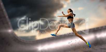 Composite image of profile view of sportswoman jumping
