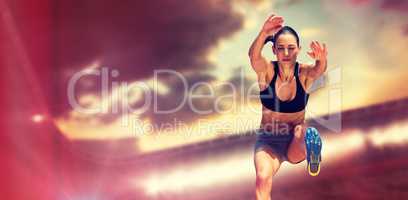 Composite image of sportswoman jumping on a white background