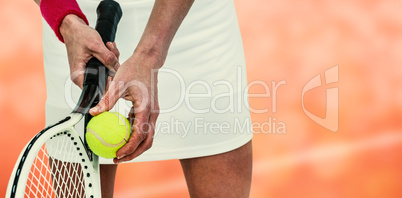 Composite image of athlete holding a tennis racquet ready to ser