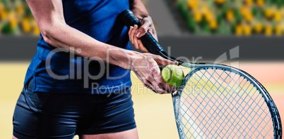 Composite image of tennis player holding a racquet ready to serv