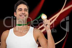 Composite image of athlete posing with gold medals around his ne