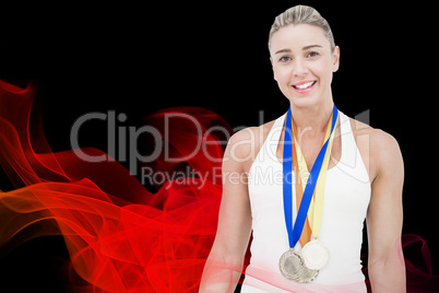 Composite image of female athlete wearing medals