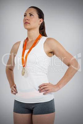 Composite image of athlete posing with gold medals around his ne