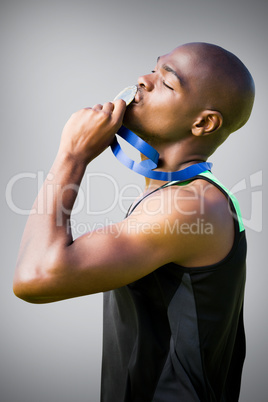 Composite image of side view of athletic man kissing his silver