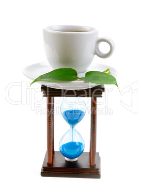 cup of coffee and an hourglass isolated on white background