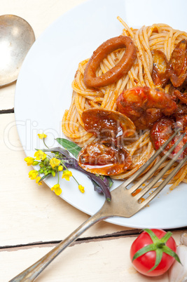 Italian seafood spaghetti pasta on red tomato sauce