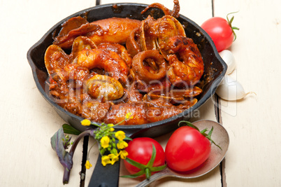 fresh seafoos stew on an iron skillet