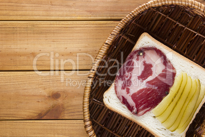 Open sandwich in a wicker basket