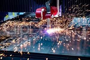 CNC Laser cutting of metal, modern industrial technology.
