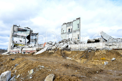 Pieces of Metal and Stone are Crumbling from Demolished Building