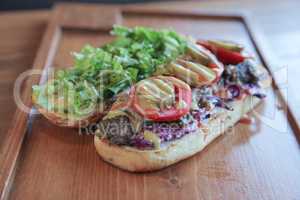 Open faced juicy Steak meaty sandwich filled with vegetables