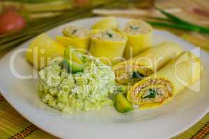 Rolls of egg pancake with turkey and mashed brussels sprouts