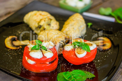 Caprese salad with chicken roll
