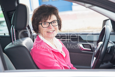 Middle-aged woman in the car